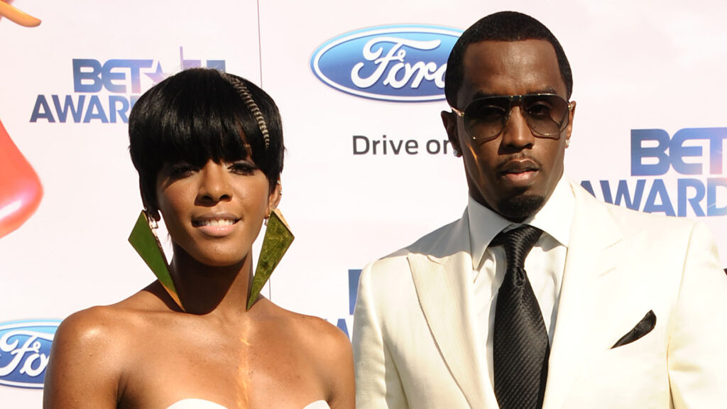 Dawn Richard and Sean "Diddy" Combs at the BET Awards. Porsha wears a strapless dress and large earrings; Diddy in a white suit and sunglasses.