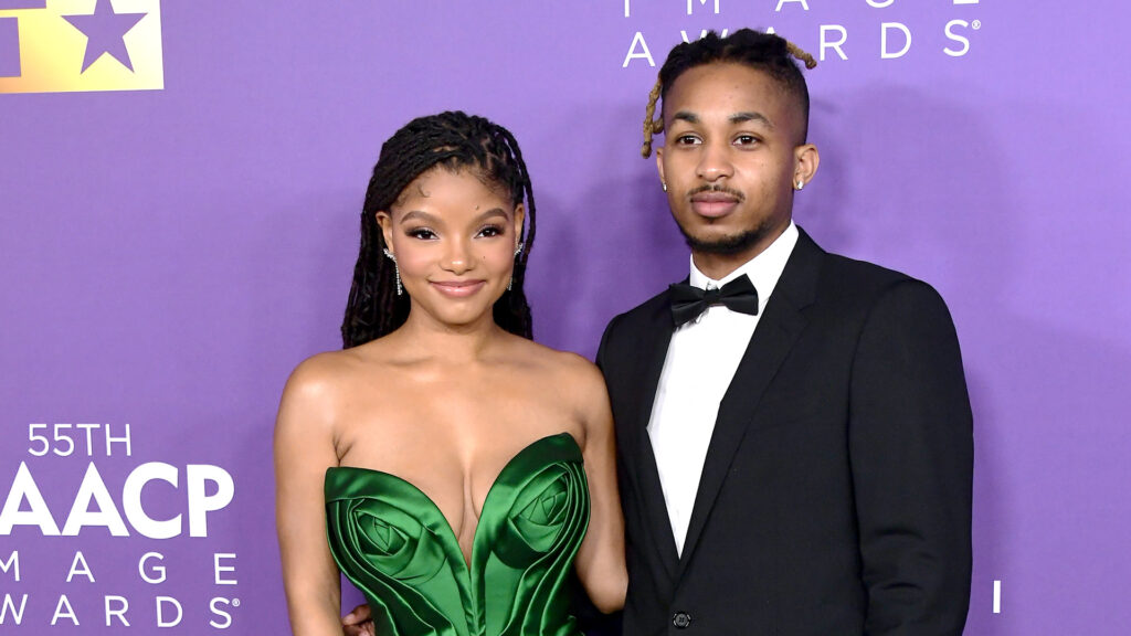 Halle Bailey in a green dress and DDG in a tuxedo at the 55th NAACP Image Awards.