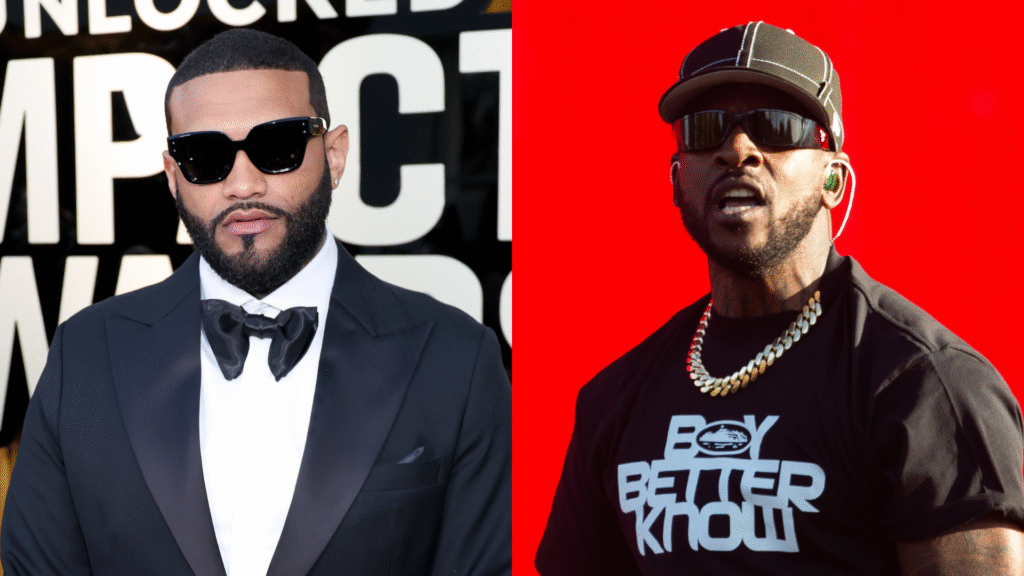Two men side by side: one in a tuxedo with sunglasses, the other in a cap and "Boy Better Know" shirt, performing energetically.