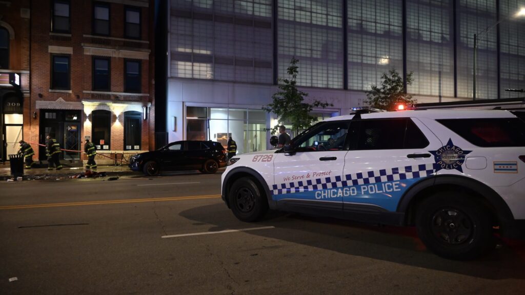 Chicago Fire Department cleans up the crime scene where numerous people were wounded in a shooting at Artis Restaurant and Lounge