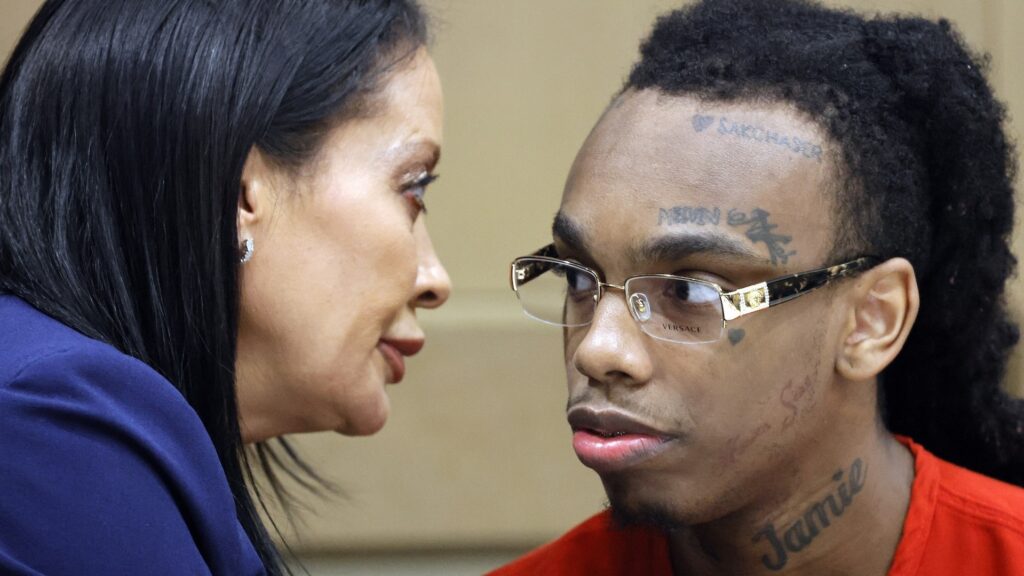 Jamell Demons, better known as rapper YNW Melly, speaks with defense attorney Raven Ramona Liberty during a hearing before his trial at the Broward County Courthouse in Fort Lauderdale, Florida, on Oct. 13, 2023. Demons is accused of killing two fellow rappers and conspiring to make it look like a drive-by shooting in October 2018.